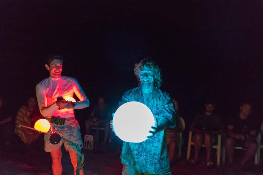 Digital Foundry team member holding a lighted orb for the evening stories and shout-outs meeting.