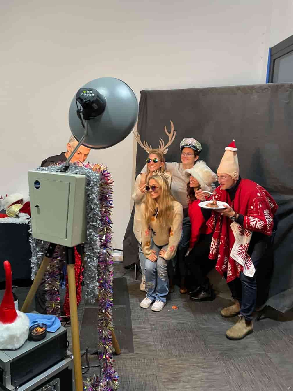 Group in winter-holiday theme costumes for a photo shoot.
