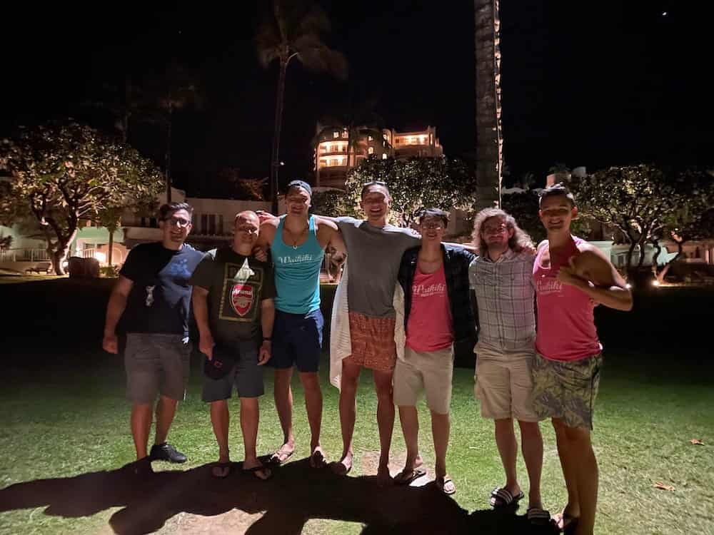 Seven team members in a shoulder embrace before the annual sharing of Digital Foundry stories.