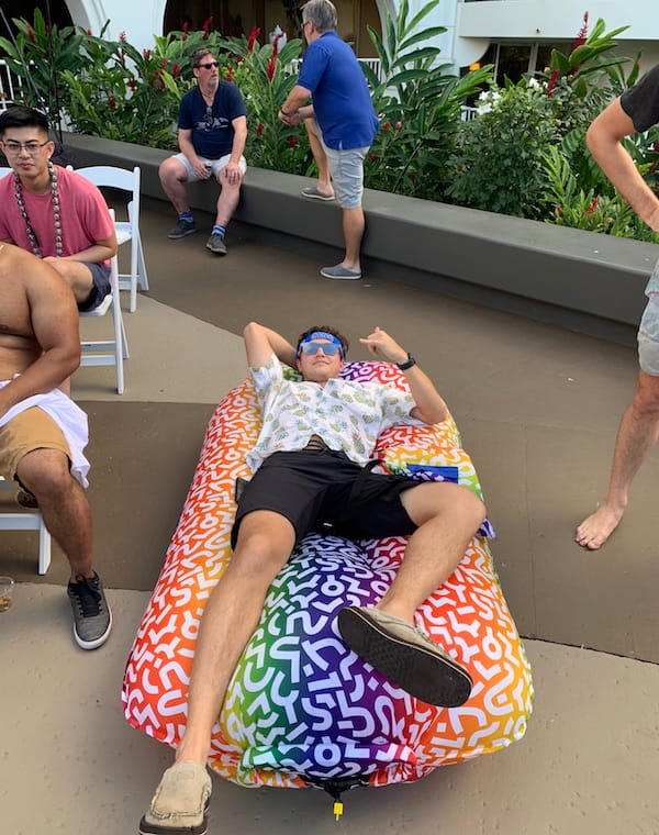 Man reclining on an air mattress.