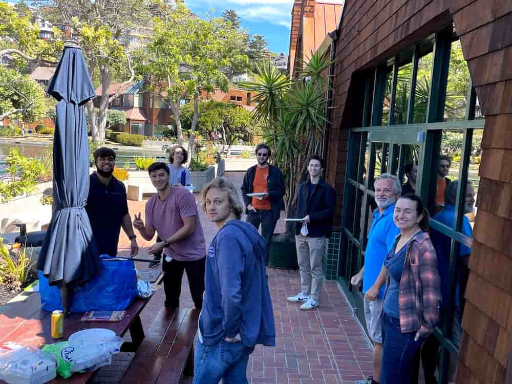 Employees outside enjoying a team lunch.