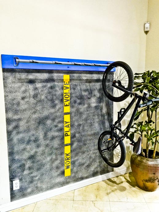 Mountain bike on an indoor wall mount in the entrance to the Digital Foundry office.