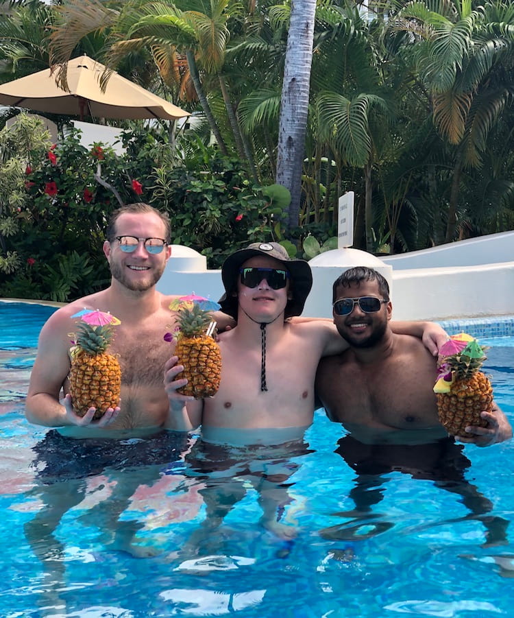 Enjoying pineapple drinks in the pool.